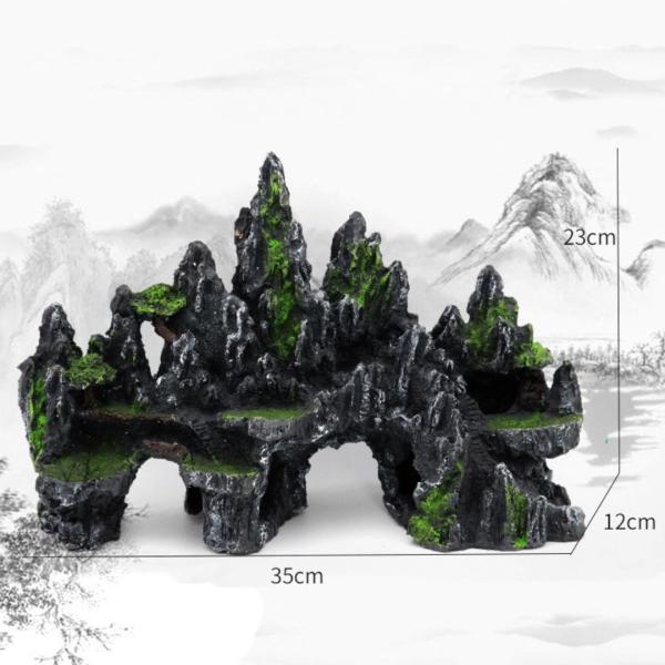 Bjerglandskab i harpiks med grønne detaljer og huler til akvarium