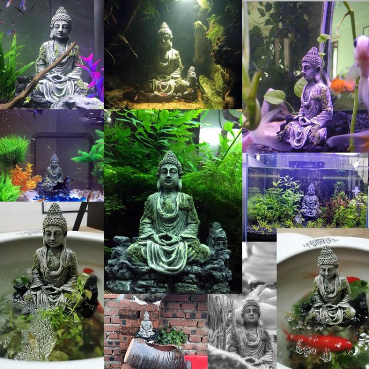 Buddha dekoration placeret i akvarium omgivet af fisk og planter