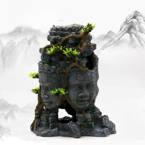 Buddha ansigtsfigur med grønne detaljer i akvarium